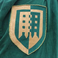 Closeup detail of the Unser Hafen badge on the cloak